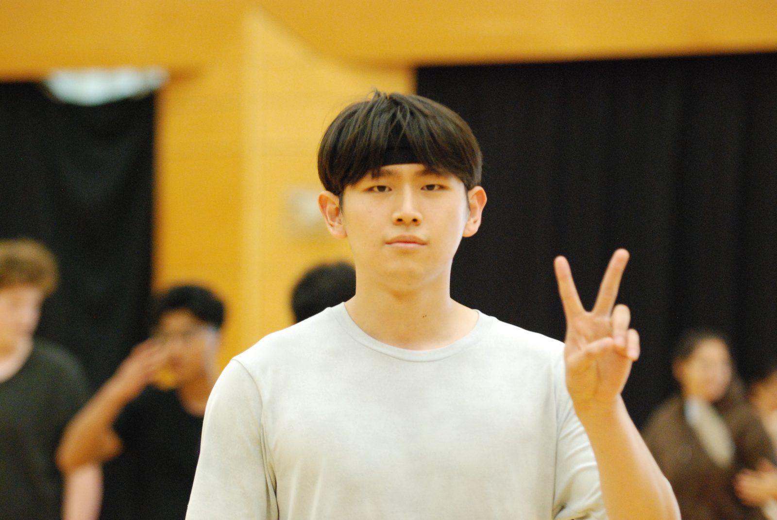 Player flashing a peace sign on court